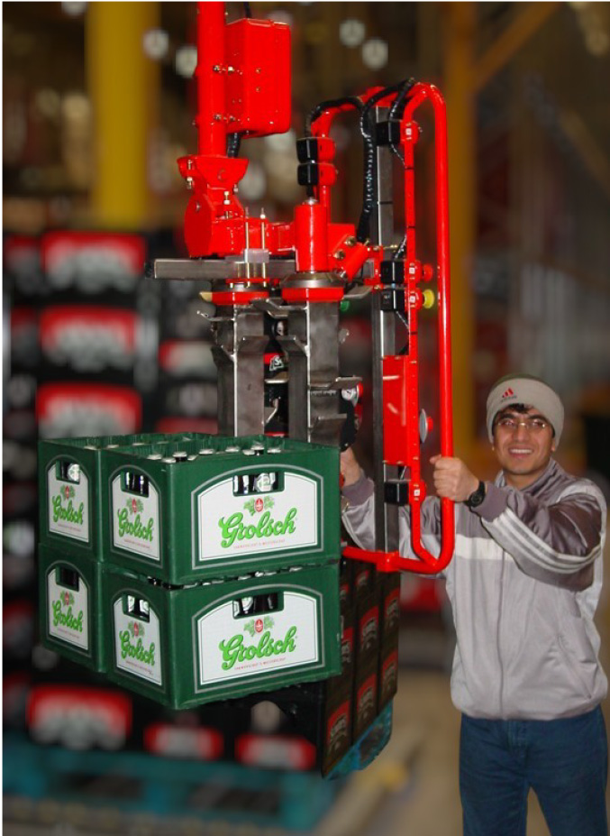 Experienced manufacturing worker extending career using zero-gravity handling system on the shop floor