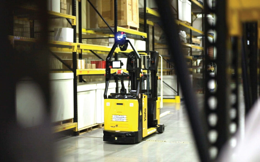 Industrial worker utilizing zero gravity lifting manufacturing ergonomics to move heavy components with a pneumatic manipulator